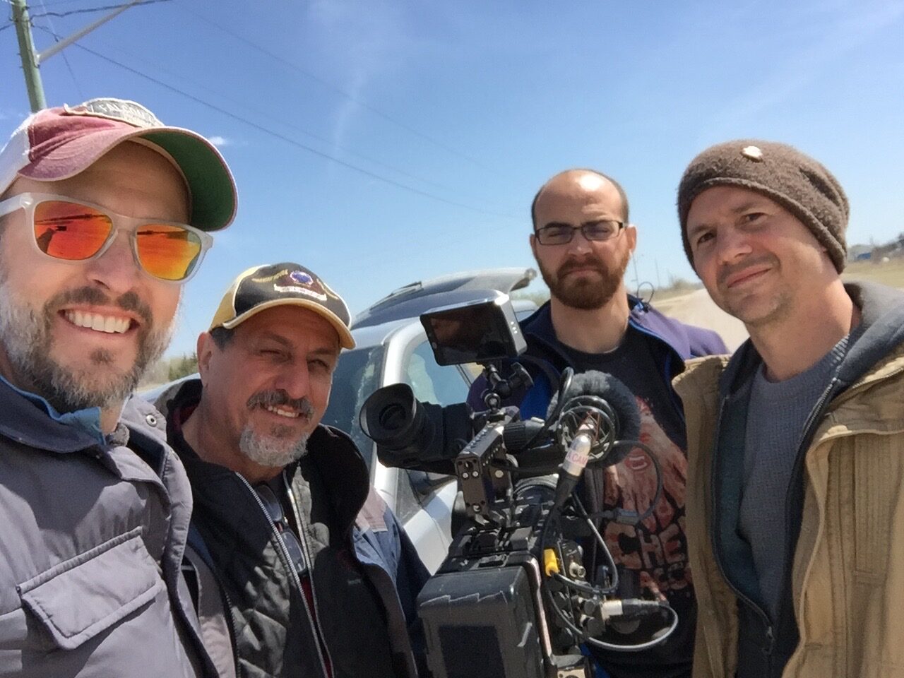Jeff Newman taking a group selfie with his film crew in the Canadian Prairies